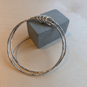 Examples of silver bangles made by students in silver bangle making jewellery workshop