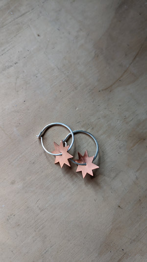Silver and copper hoops handmade in silver jewellery making workshop