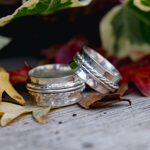 Examples of spinner fidget rings made by students in the silver jewellery workshop