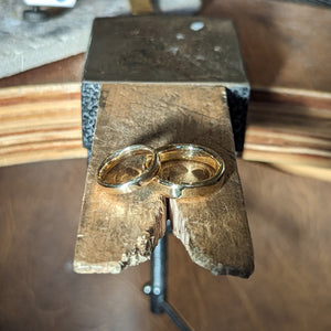 Examples of handmade gold wedding bands made in private jewellery making workshop
