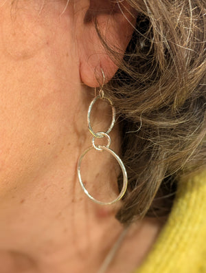An example of a handcrafted silver drop earrings made in silver jewellery making workshop
