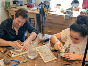 Couple creating their own wedding bands in private workshop 