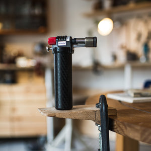 Blow torch used to help craft unique pieces in silver jewellery making workshop