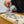Wedding band being blowtorched by student in jewellery making workshop class