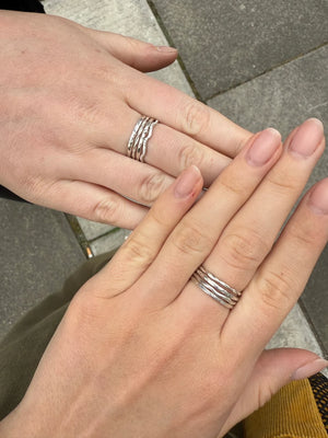 Collection of stacking rings hand crafted in silver and copper in jewellery making class Cardiff