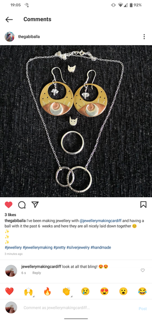 Student showcases their handmade silver and copper jewellery created at the workshop