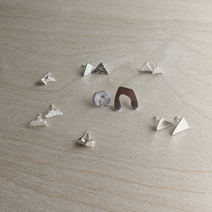 Examples of stud earrings made from silver in jewellery making workshop