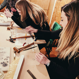 Students crafting their designs in silver jewellery workshop