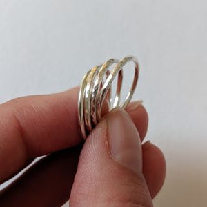 Examples of handmade silver stack rings made in jewellery making workshop