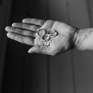 Student shows collection of handmade silver rings made in jewellery making workshop